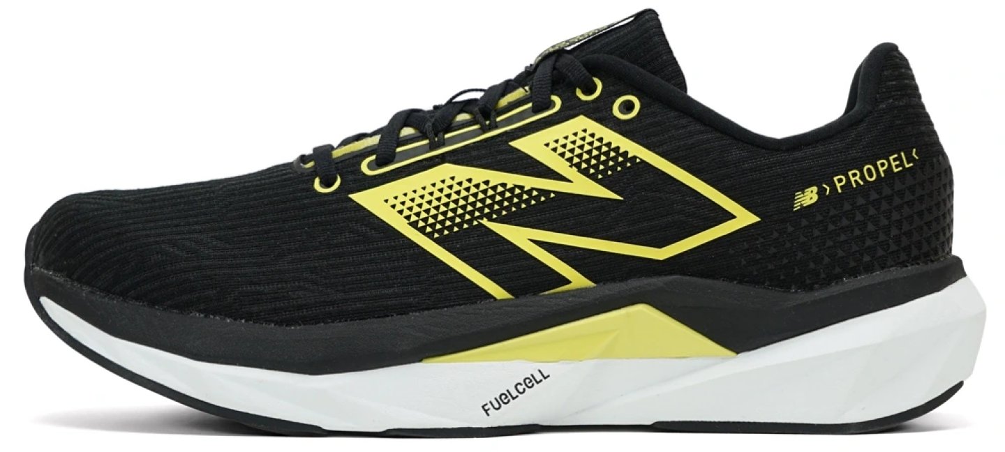 New Balance FuelCell Propel V5 running shoe in black and yellow, lateral view showing FuelCell midsole and mesh upper.