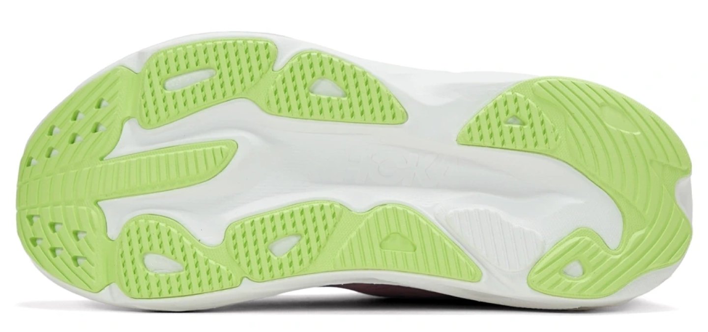 Bottom view of the Hoka Skyflow Stride running shoe outsole with lime green rubber traction zones on a white midsole