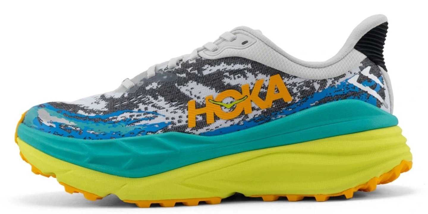 Hoka Stinson ATR 7 trail running shoe in white, teal, yellow and orange colourway, lateral side view