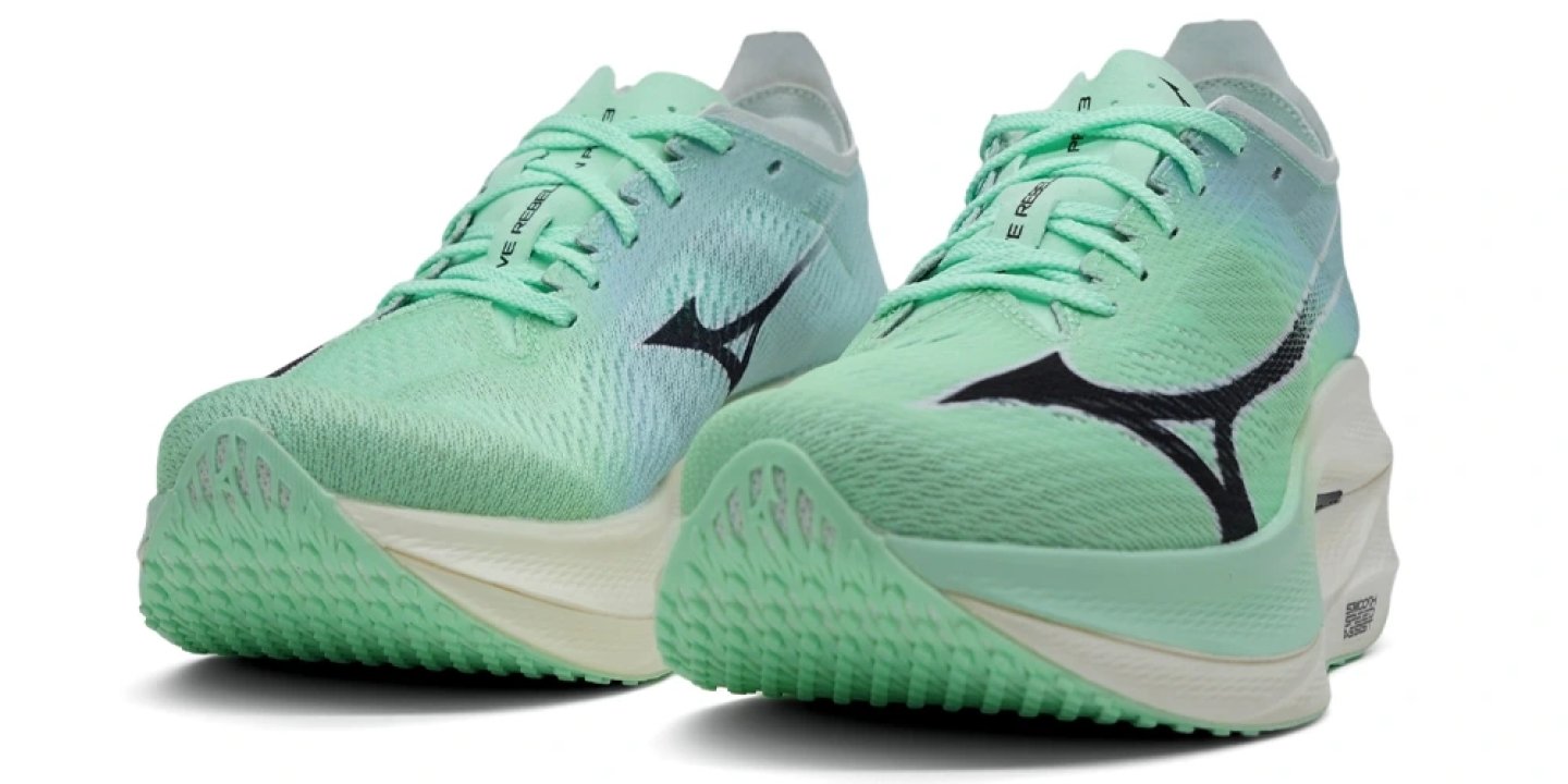 Pair of Mizuno Wave Rebellion Pro 3 running shoes in mint green with black Mizuno logo and chunky midsole