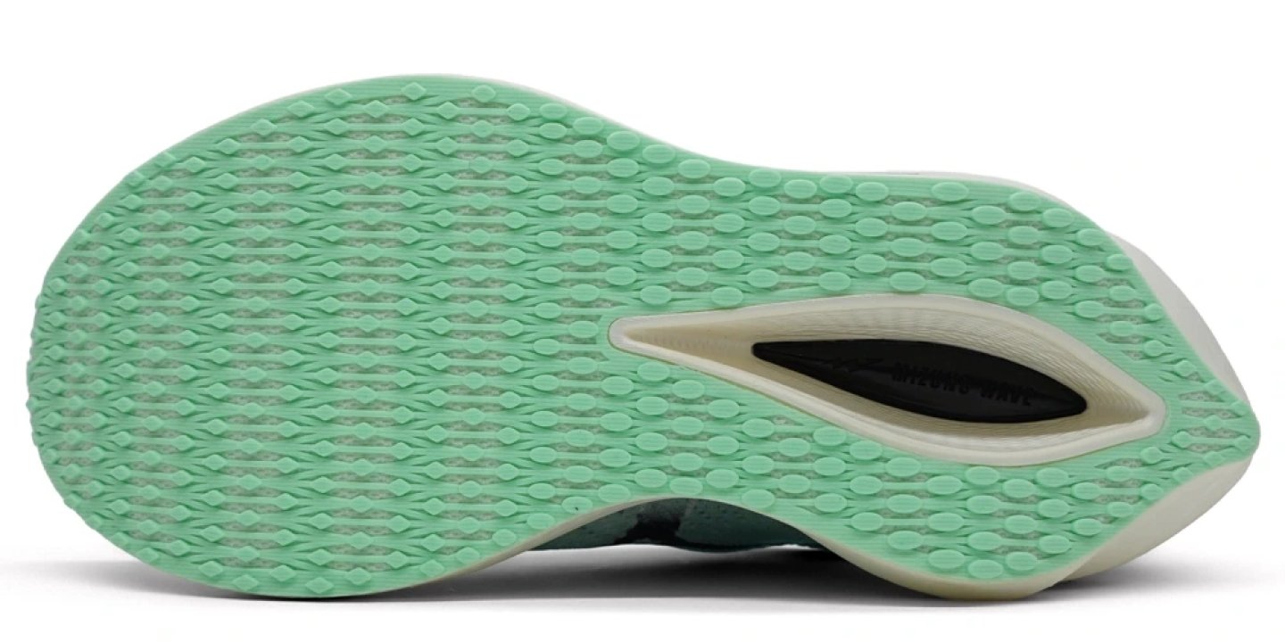 Bottom view of the Mizuno Wave Rebellion Pro 3 running shoe showing mint green rubber outsole with dot traction pattern