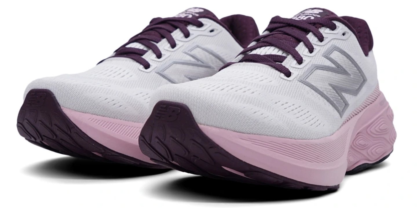 New Balance 880 v15 women's running shoes in white with pink midsole and dark plum collar and laces, angled front view