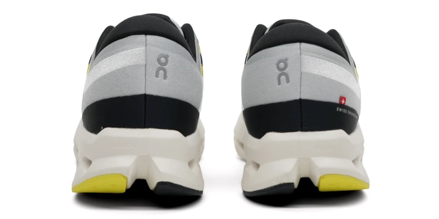 Heel view of the On Cloudsurfer 2 running shoes in grey, black and yellow with CloudTec midsole