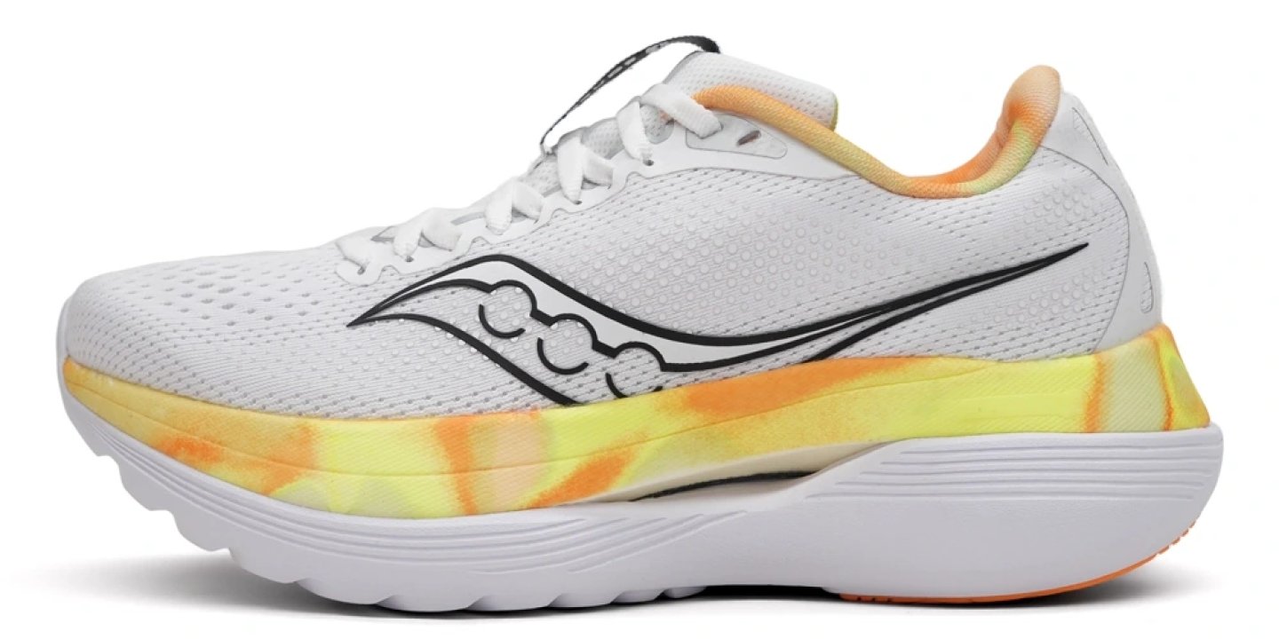 Saucony Endorphin Trainer running shoe in white with yellow and orange tie-dye midsole, lateral side view