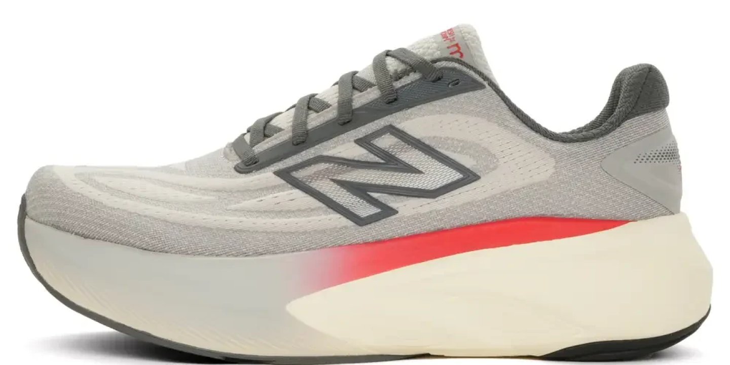 New Balance Fresh Foam running shoe in grey with red, orange, and yellow tiger-stripe graphics and white midsole.