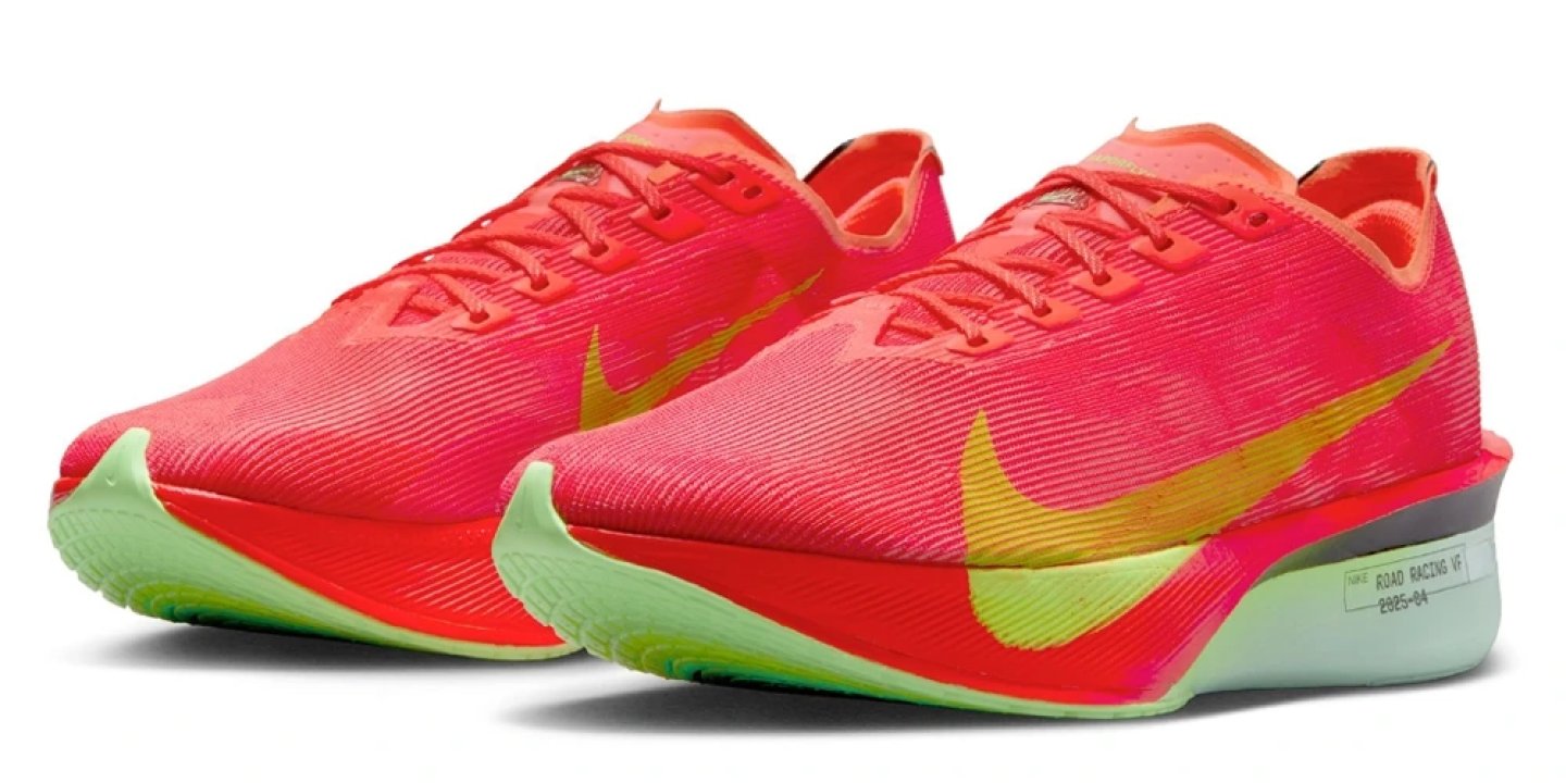 Nike Vaporfly 4 road racing shoe in bright crimson and volt with a lime green midsole, pair angled view