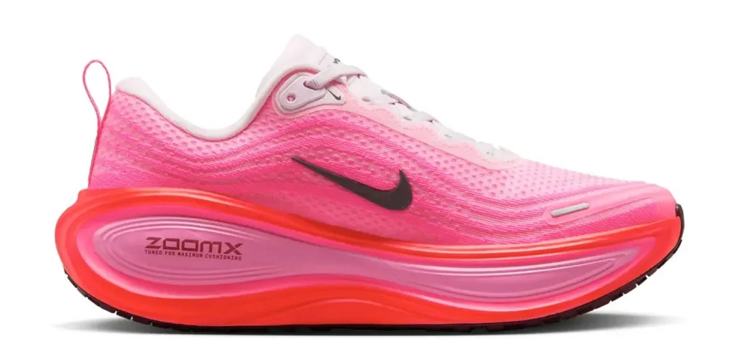 Nike ZoomX running shoe in pink gradient upper with red-coral midsole, lateral side view on white background.