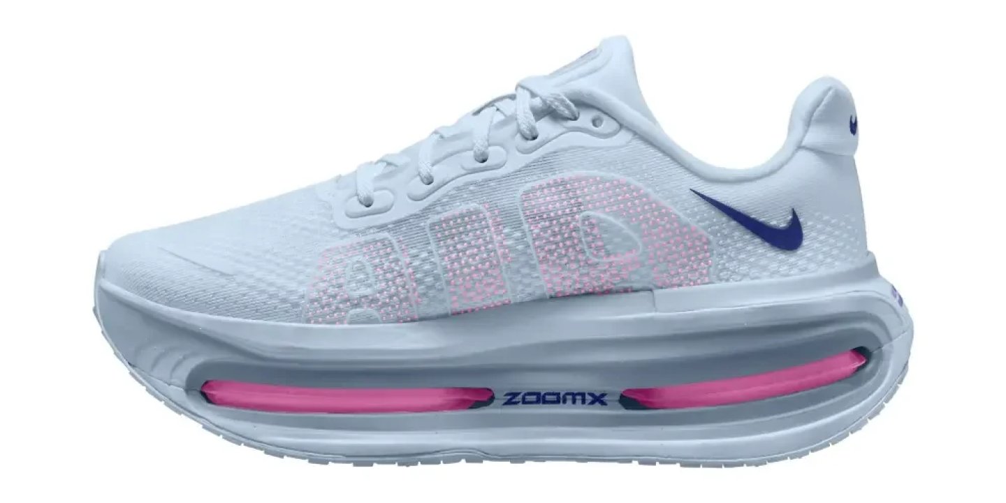 Nike ZoomX running shoe in white with blue Swoosh, pink Air unit in midsole, lateral view on white background.