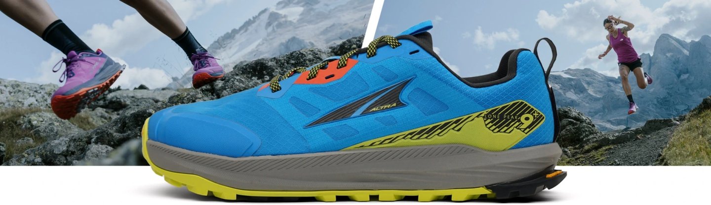 Altra Lone Peak 9+ trail running shoe in blue and yellow with aggressive outsole, shown against alpine mountain backdrop