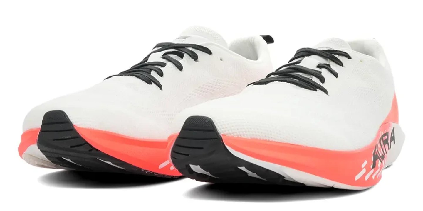 Pair of Altra Vanish Pulse running shoes in white with coral midsole and black outsole, studio shot on white background.