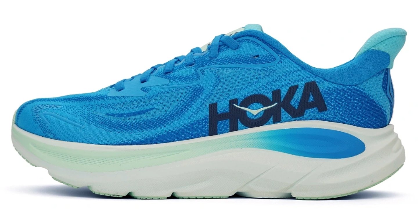 HOKA women's road running shoe in bright blue with white chunky midsole, breathable mesh upper, and aqua heel accent