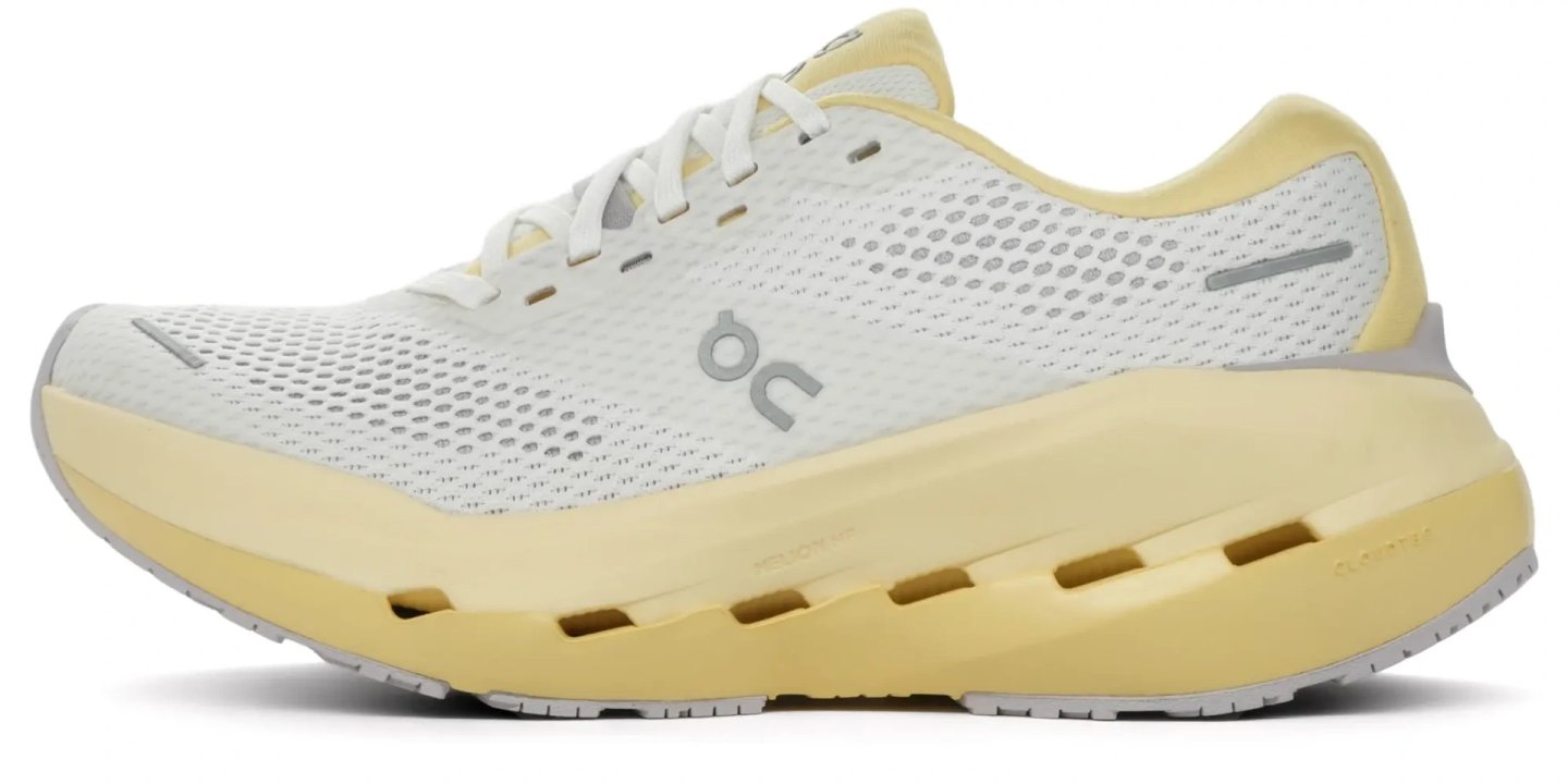 On Cloudrunner 3 Max running shoe in white and pale yellow, featuring a large cushioned midsole with CloudTec pods, lateral view.