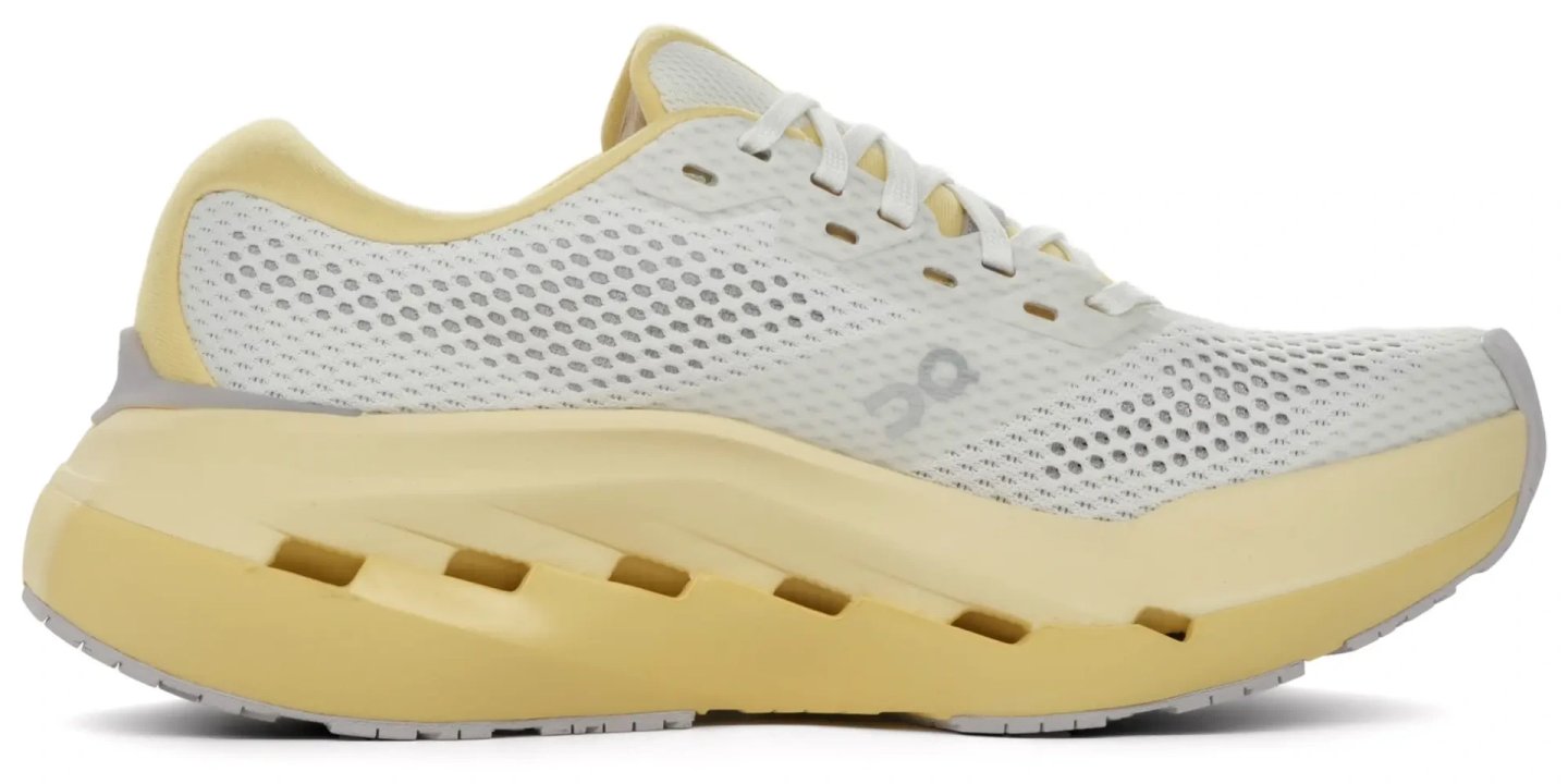 On Cloudrunner 3 Max running shoe in white and yellow with chunky midsole, side profile view