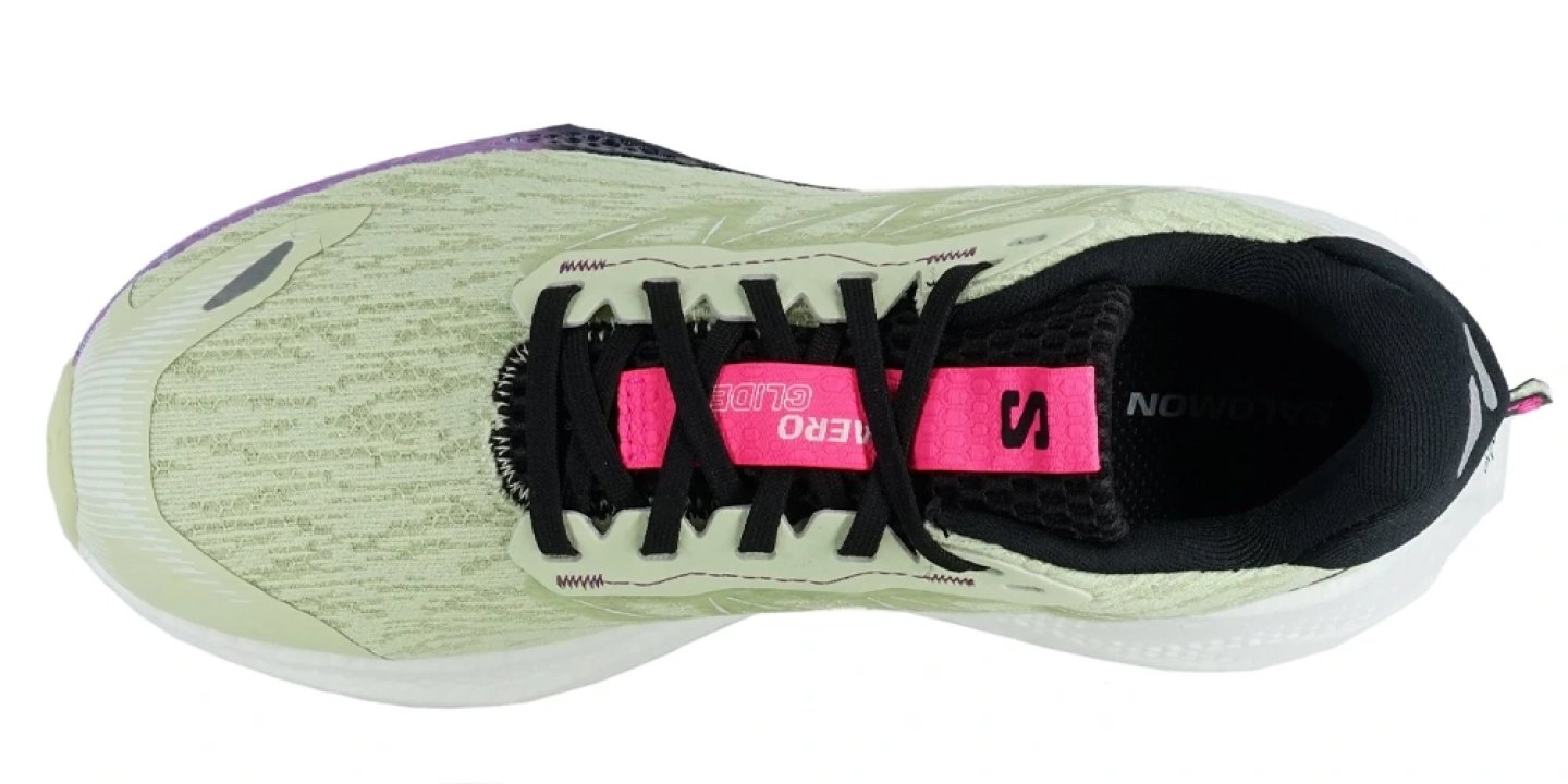 Top-down view of Saucony Aero Glide women's running shoe in lime green with black laces and hot pink tongue label