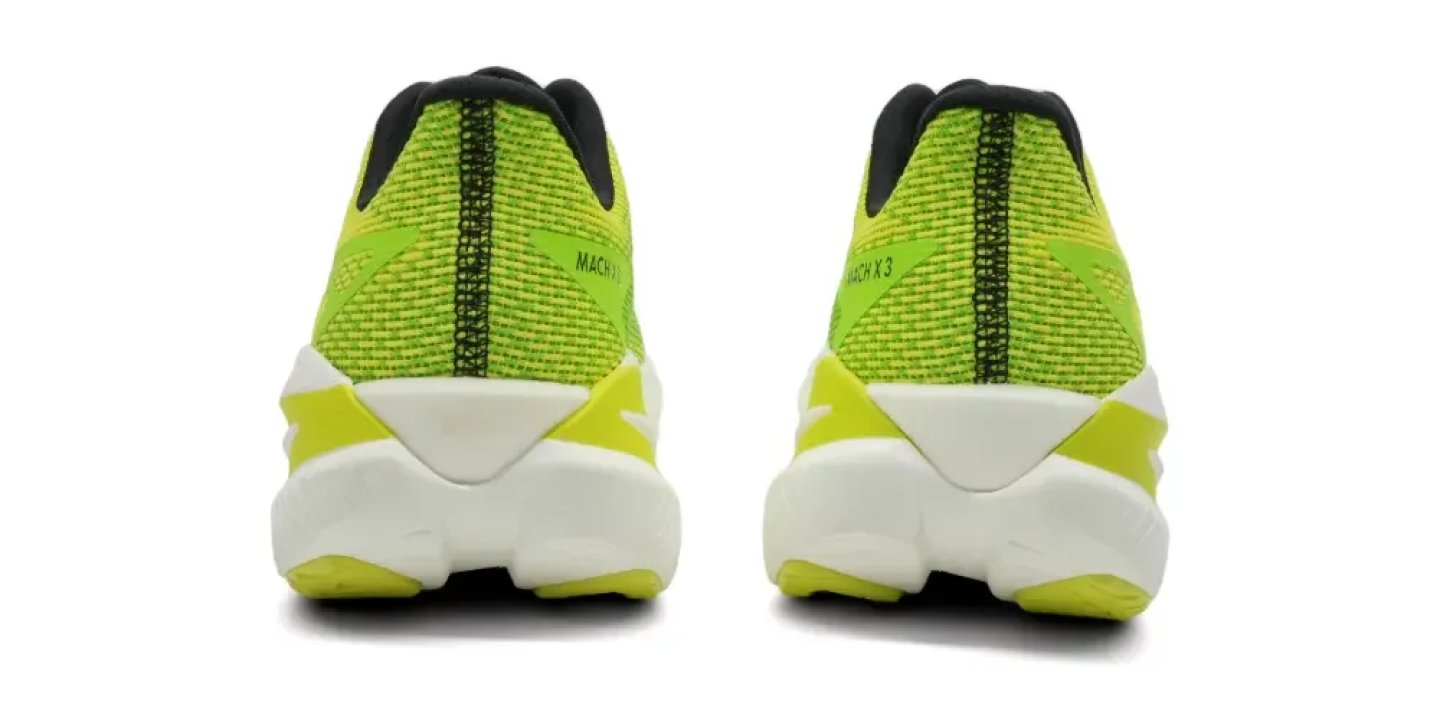 Rear view of Hoka Mach X 3 running shoes in lime green with white cushioned midsole and black heel collar.