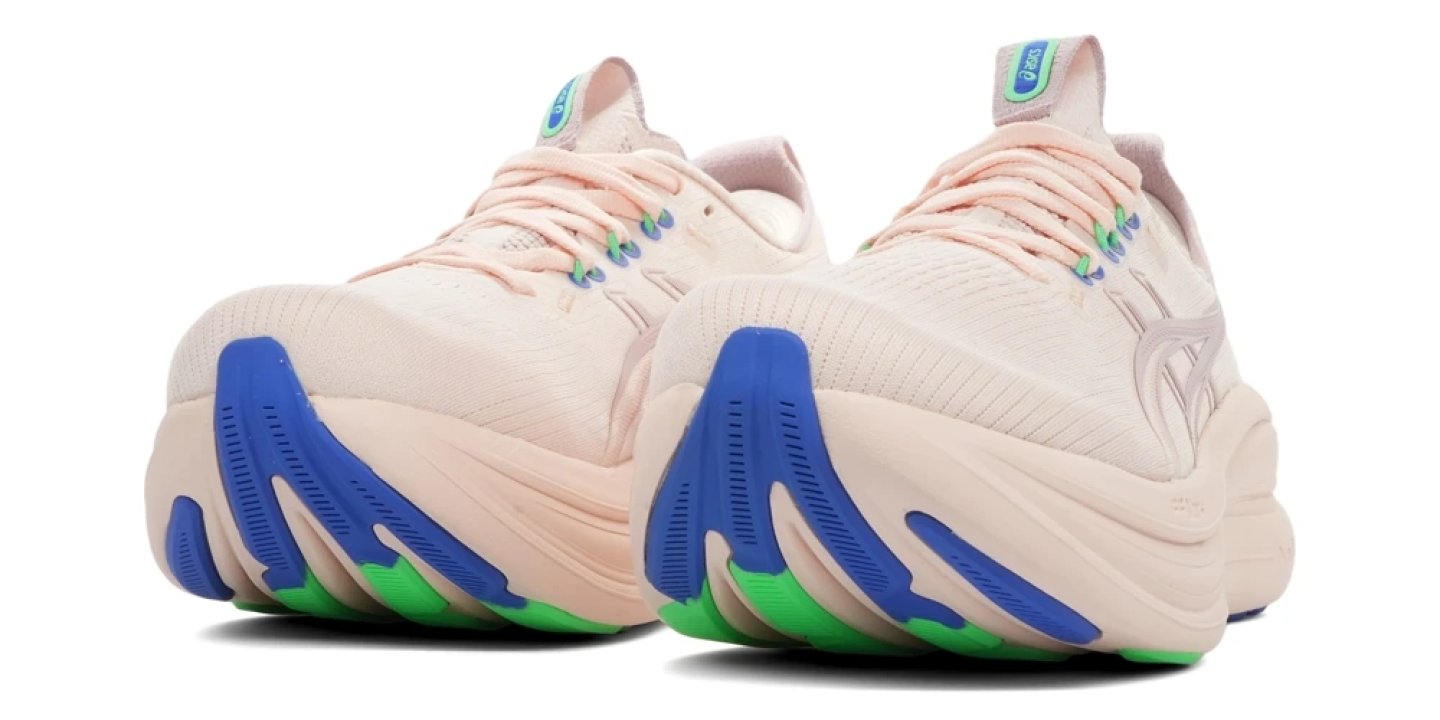 Rear view of ASICS Novablast 4 women's running shoes in pale pink with blue midsole and green outsole